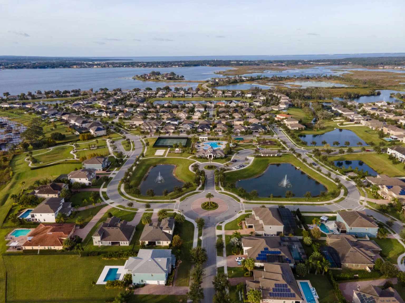 Aerial view of Hickory Hammock homes, ponds and roundabout with Johns Lake beyond