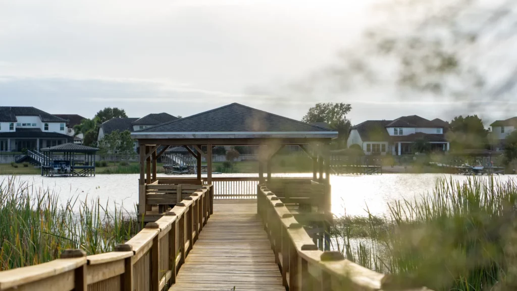 Covered pier and boardwalk on the lake at Hickory Hammock