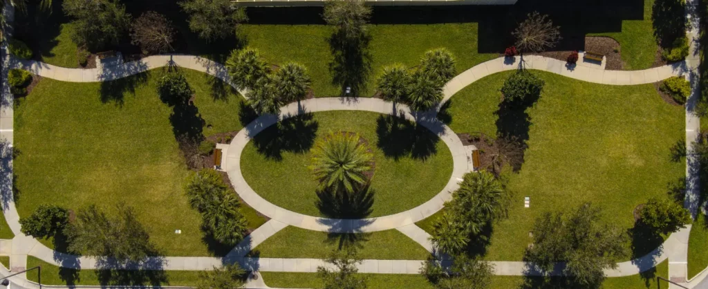 Aerial view of a landscaped park with walking paths at Hickory Hammock