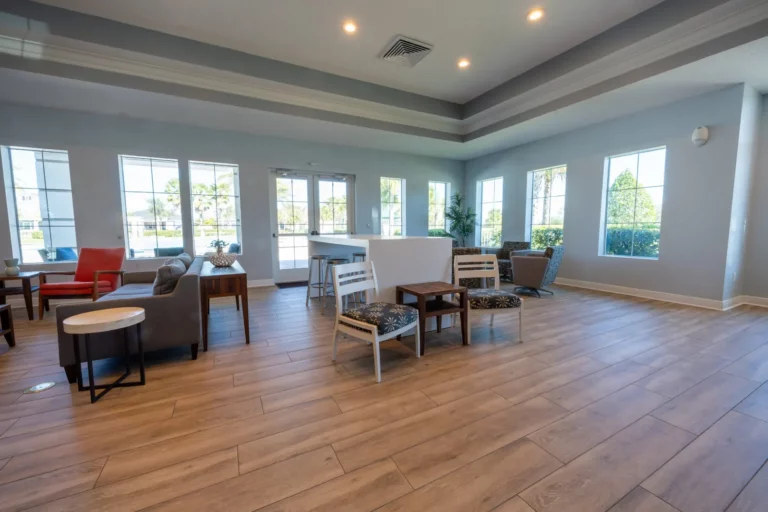 Hickory Hammock clubhouse lounge with seating and large windows
