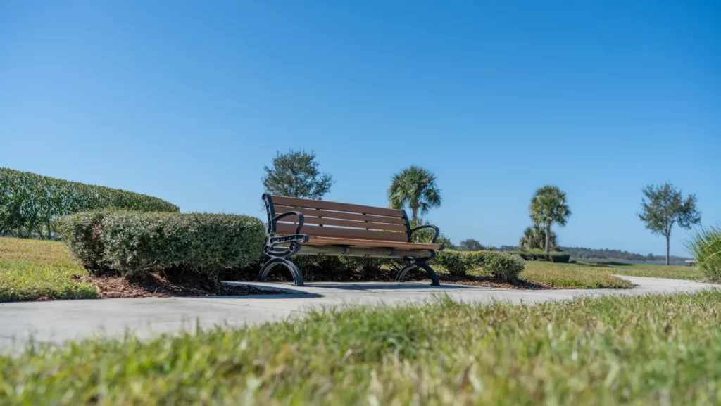 Park bench along a walking path at Hickory Hammock