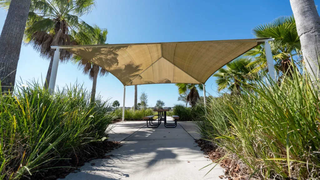 Shaded picnic pavilion surrounded by palms at Hickory Hammock